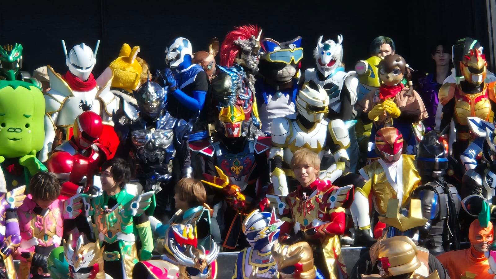 Sacred Guardian Singa standing amongst the local heroes of Japan